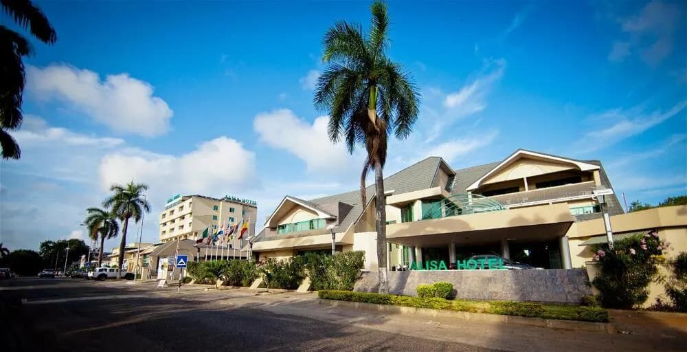 Daytime exterior of Alisa Hotel North Ridge in Accra, a Nii Plants car-hire pickup desk