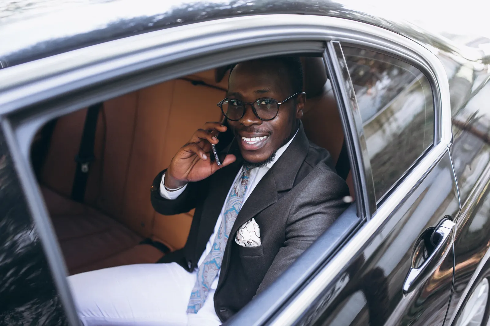 A business traveller using a Nii Plants car in Accra