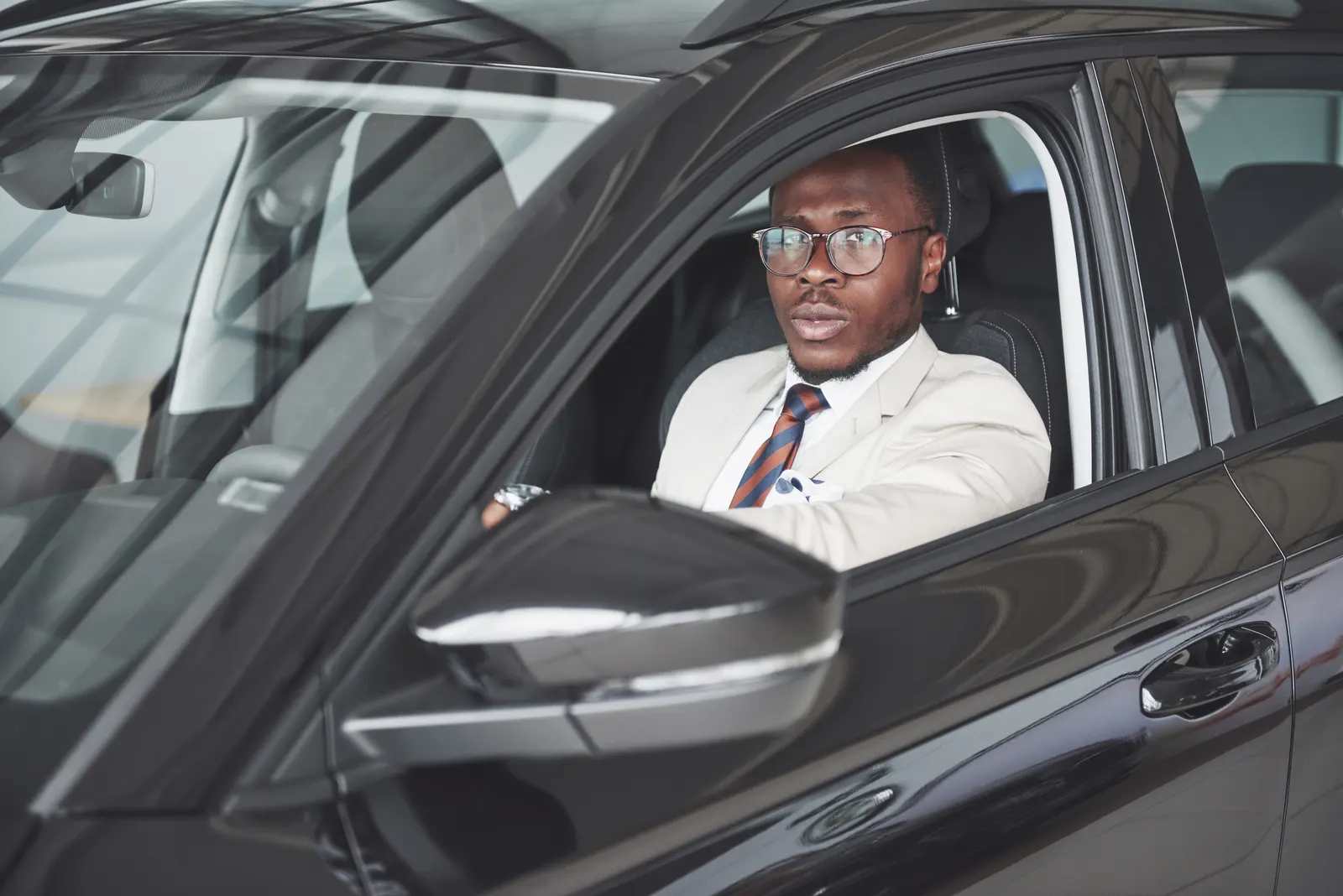 A professional driver at the wheel of a Nii Plants car