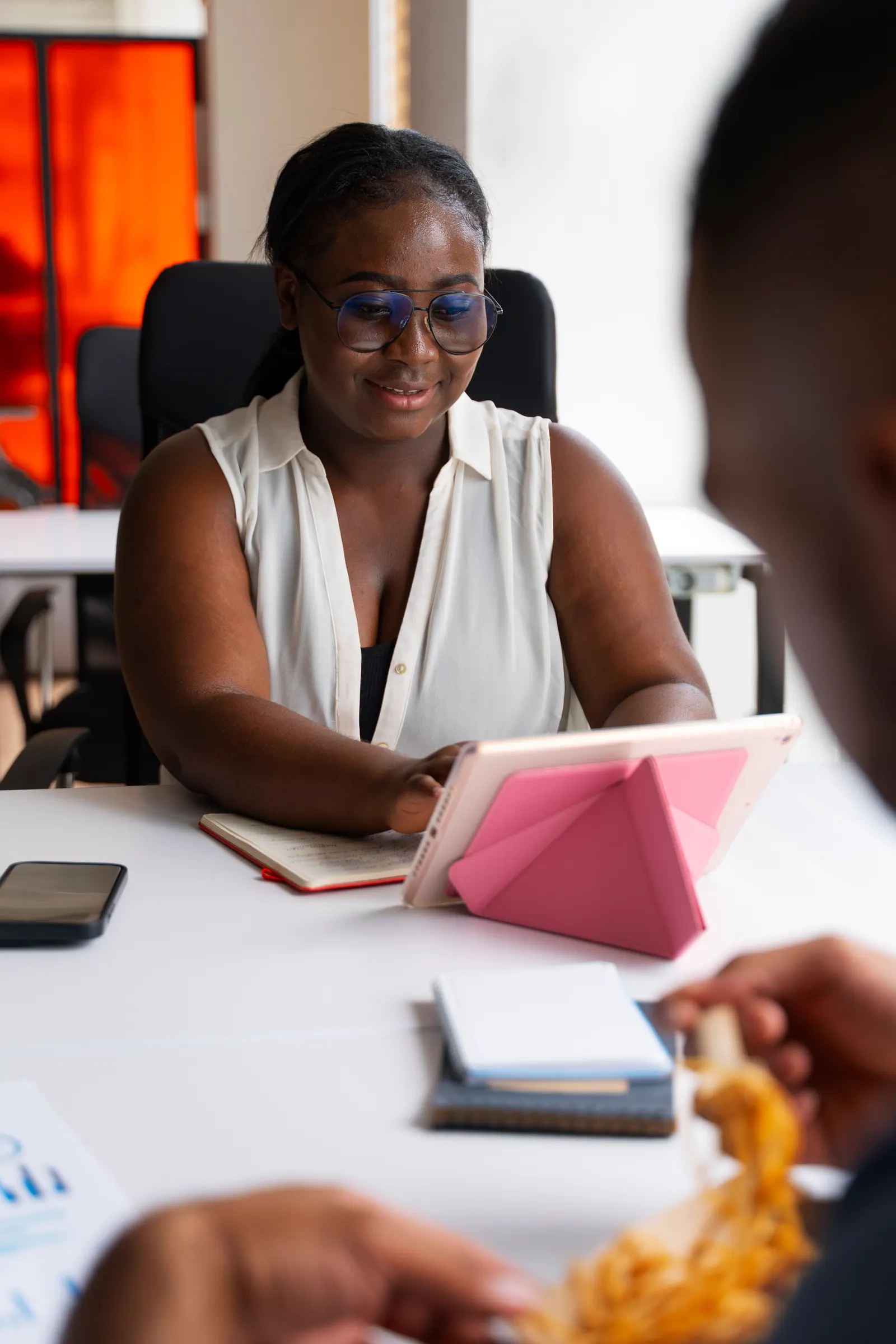 Staff at work arranging car hire from the Accra office