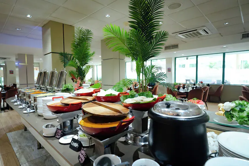 Buffet at a partner hotel used for Nii Plants pickup, with goat light soup, okra, and turkey groundnut soup